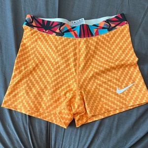 Nike pro dri fit shorts goldish orange patterned band